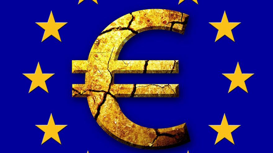 Símbolo del euro rodeado de las estrellas de la bandera europea sobre fondo azul