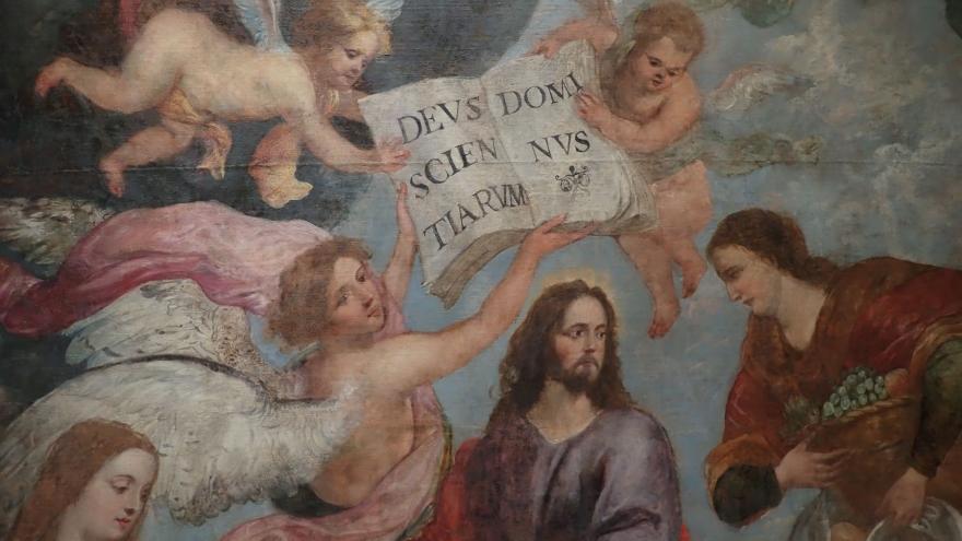 imagen de un lienzo con un personaje central representando a Cristo rodeado de ángeles