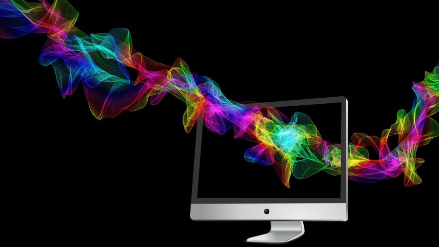 Pantalla de ordenador atravesado por espiral de colores