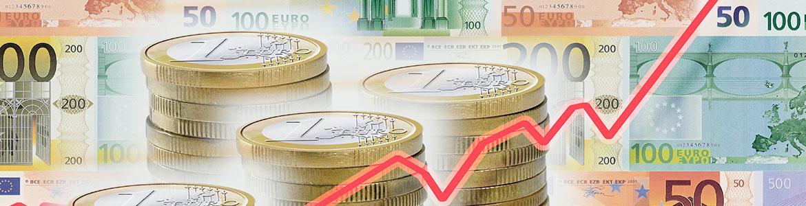 Imagen de billetes de monedas y euros y escala bursatil