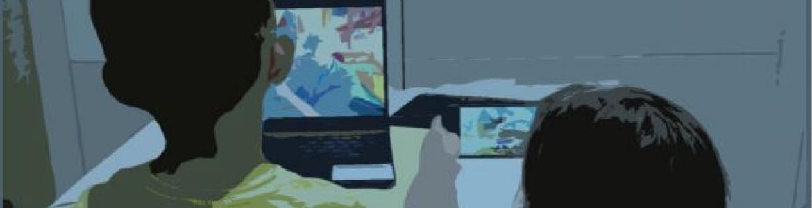 Dos niños frente a la pantalla de un ordenador