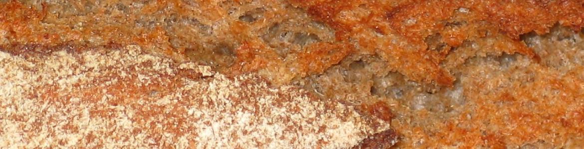 Panaderóa, bollería y pastelería industrial Imagen macro de la corteza de una barra de pan